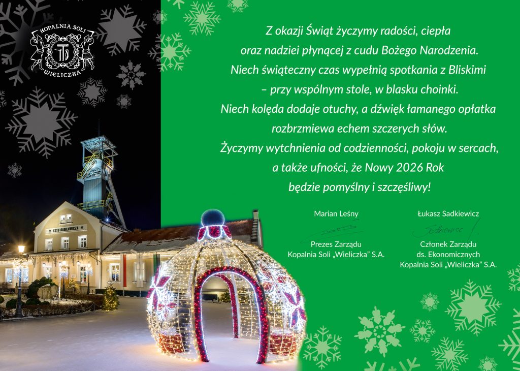 Świąteczna grafika. Treść życzeń białą czcionką na zielonym tle. Po lewej strony widok nocny na szyn Daniłowicza, na planie pierwszym świecąca świąteczna dekoracja w kształcie bombki